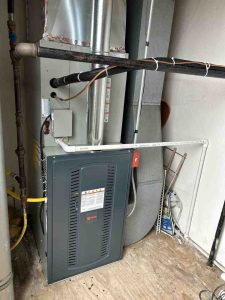 furnace service and repair technician inspecting furnace